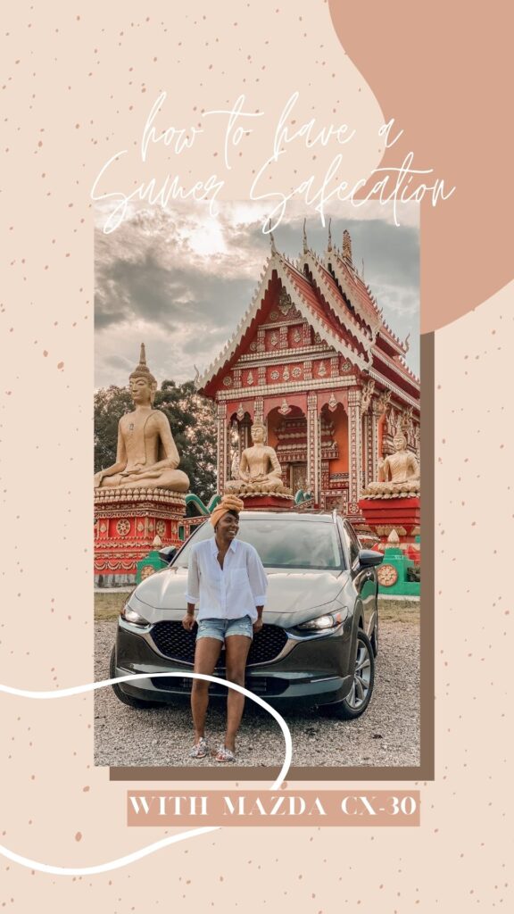 Black travel blogger World of a Wanderer in front of a Mazda-CX 30 at a Laotian temple in Atlanta